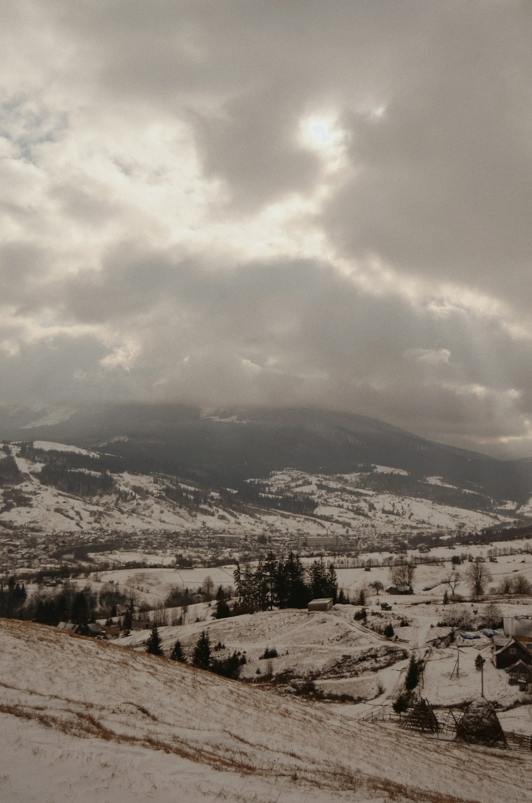 white and brown mountain under white clouds during daytime