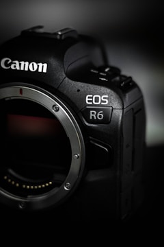 black nikon dslr camera on white table
