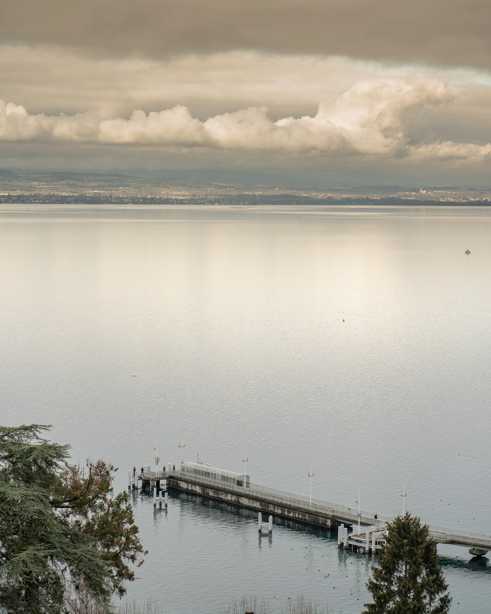 body of water near bridge during daytime