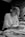 woman in long sleeve shirt writing on notebook