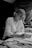 woman in long sleeve shirt writing on notebook