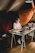 A vibrant portrait of a focused creator working intently at their desk amidst a calming, organized space.