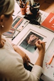 boy in white shirt holding painting