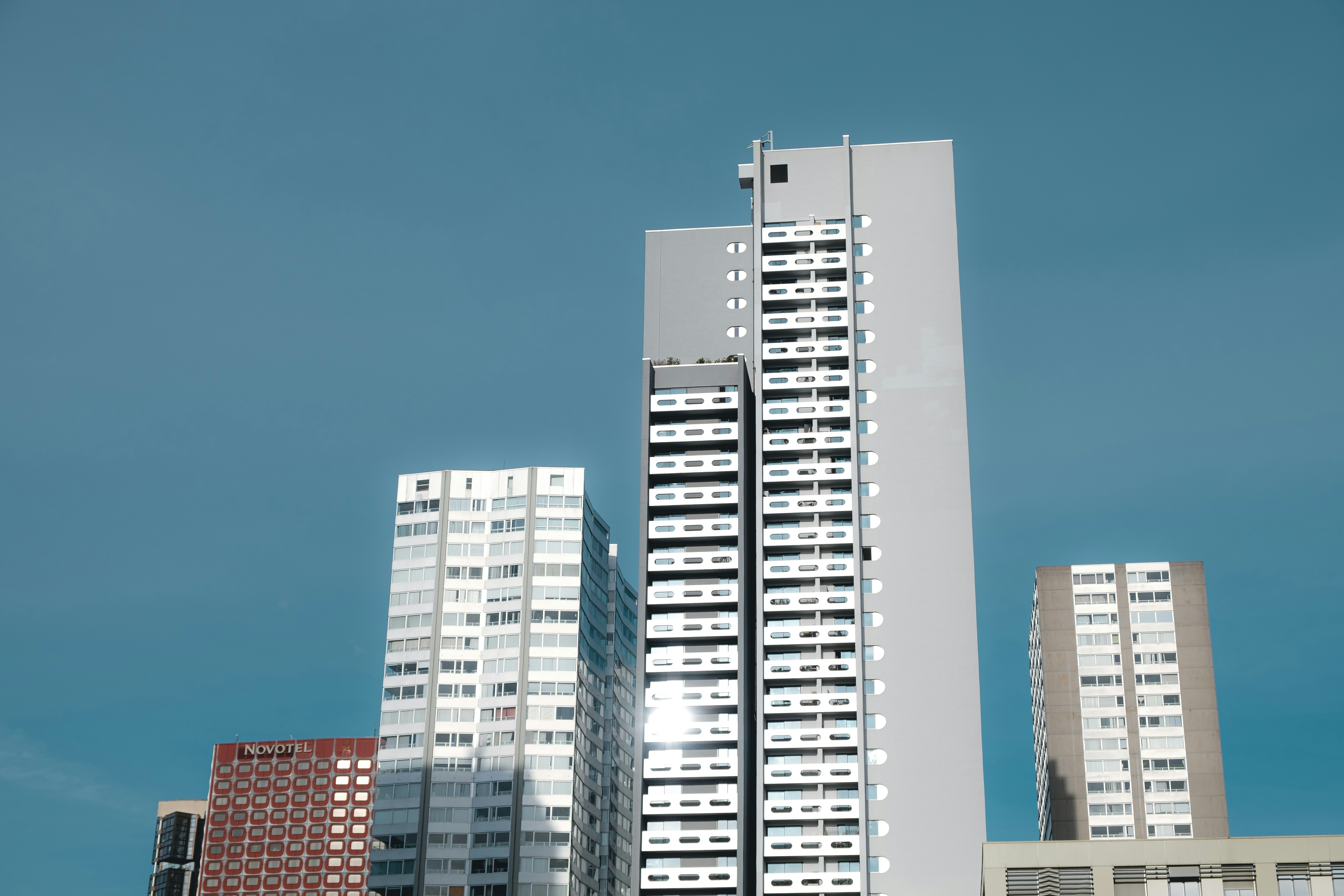 white and blue high rise building