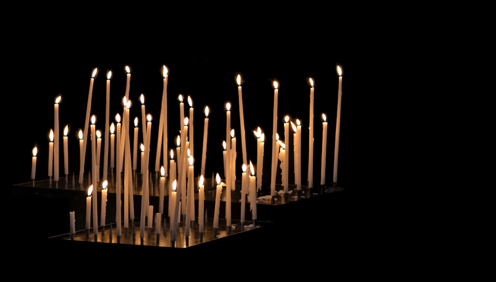 lighted candles on black background