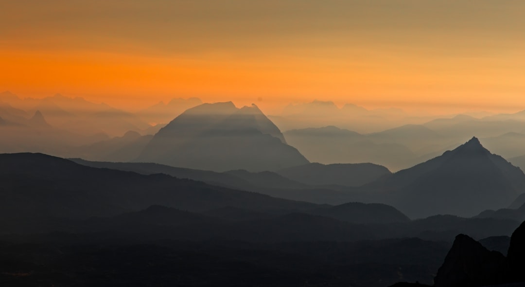 silhouette of mountains during sunset