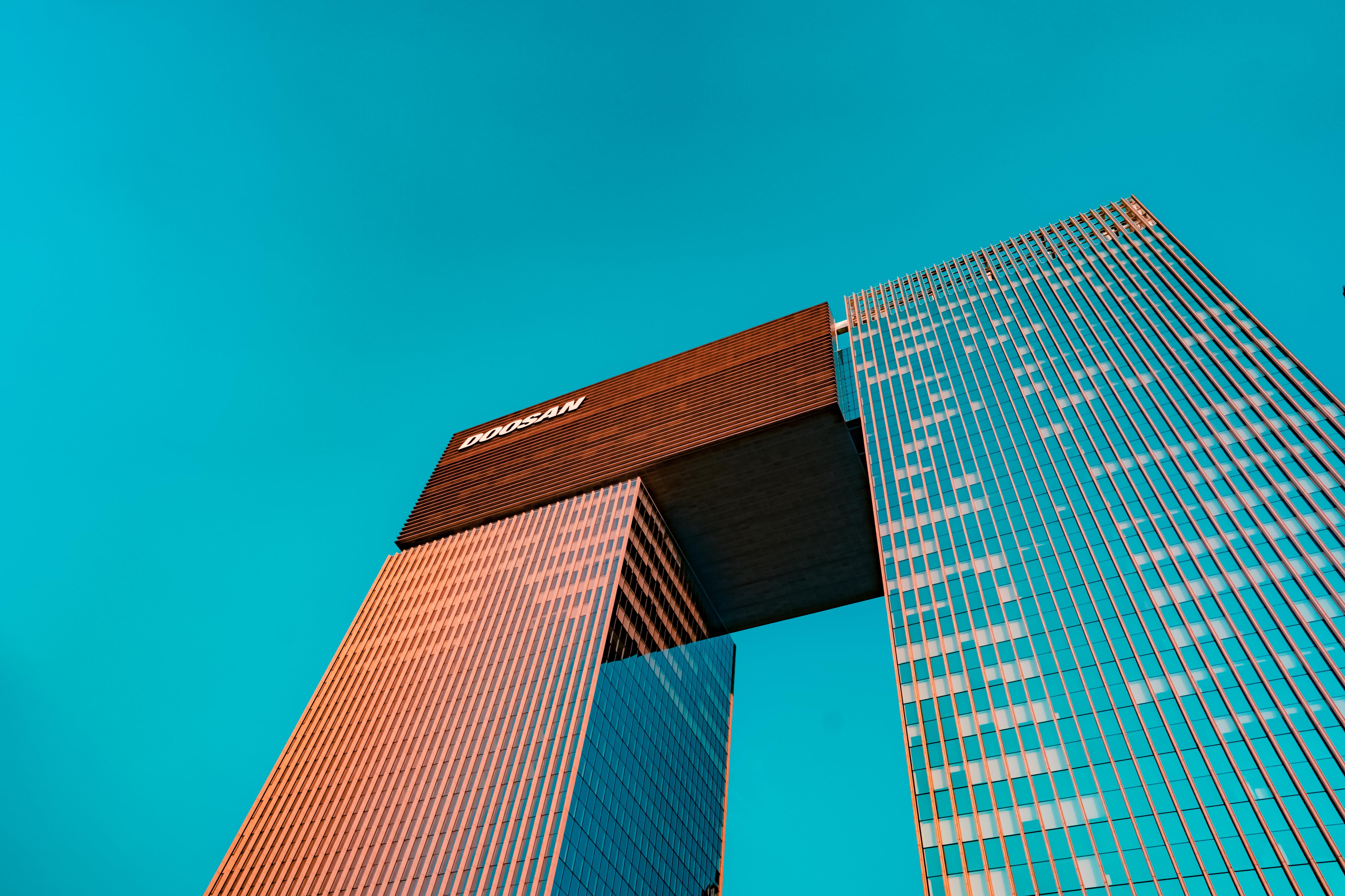 blue glass walled high rise building