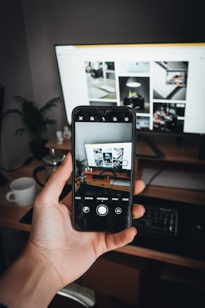 A cozy setup showing a person browsing gecko photos on a smartphone.