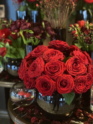 Sophisticated floral centerpiece with a mix of roses and seasonal blooms in a sleek vase