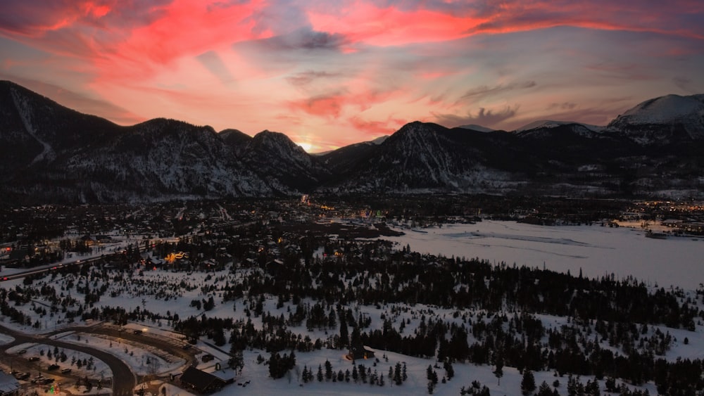 snow covered mountain during sunset