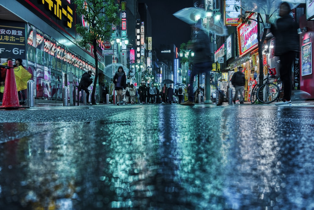 people walking on street during night time