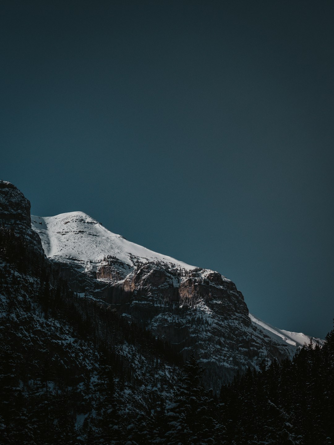 snow covered mountain under blue sky during daytime