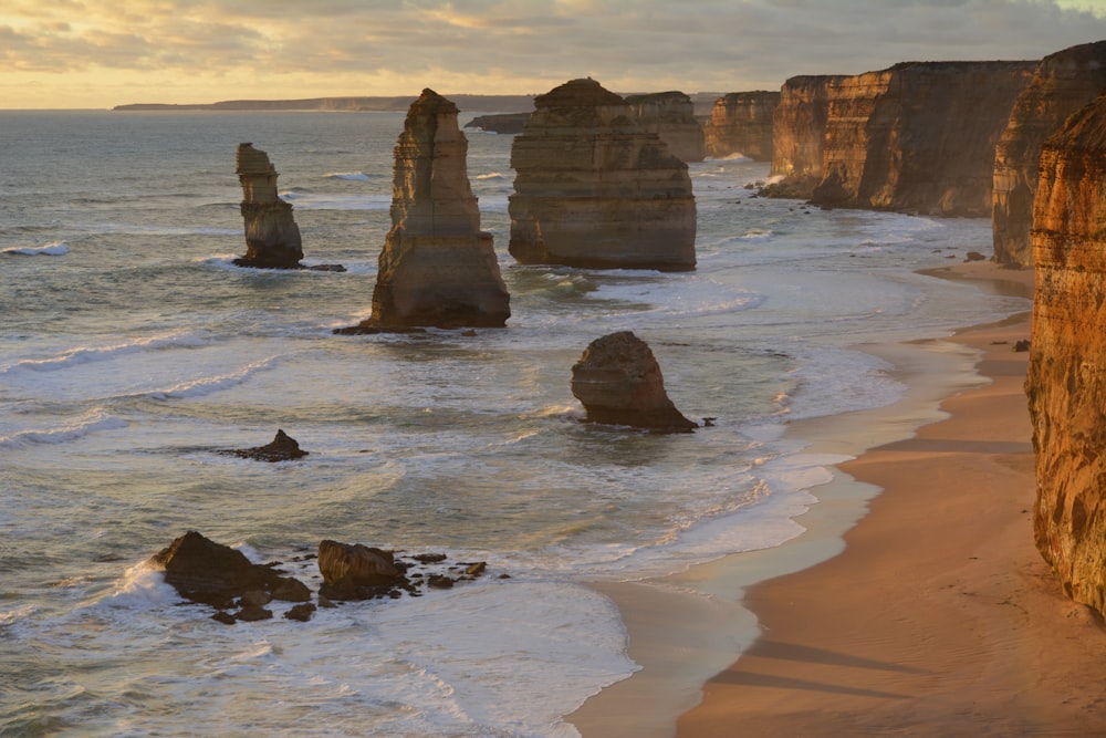 brown rock formation on sea shore during daytime