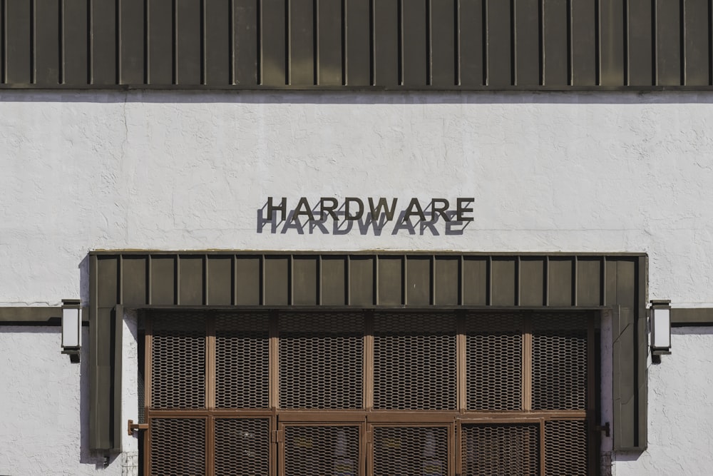 a white building with a sign that says hardware hardware