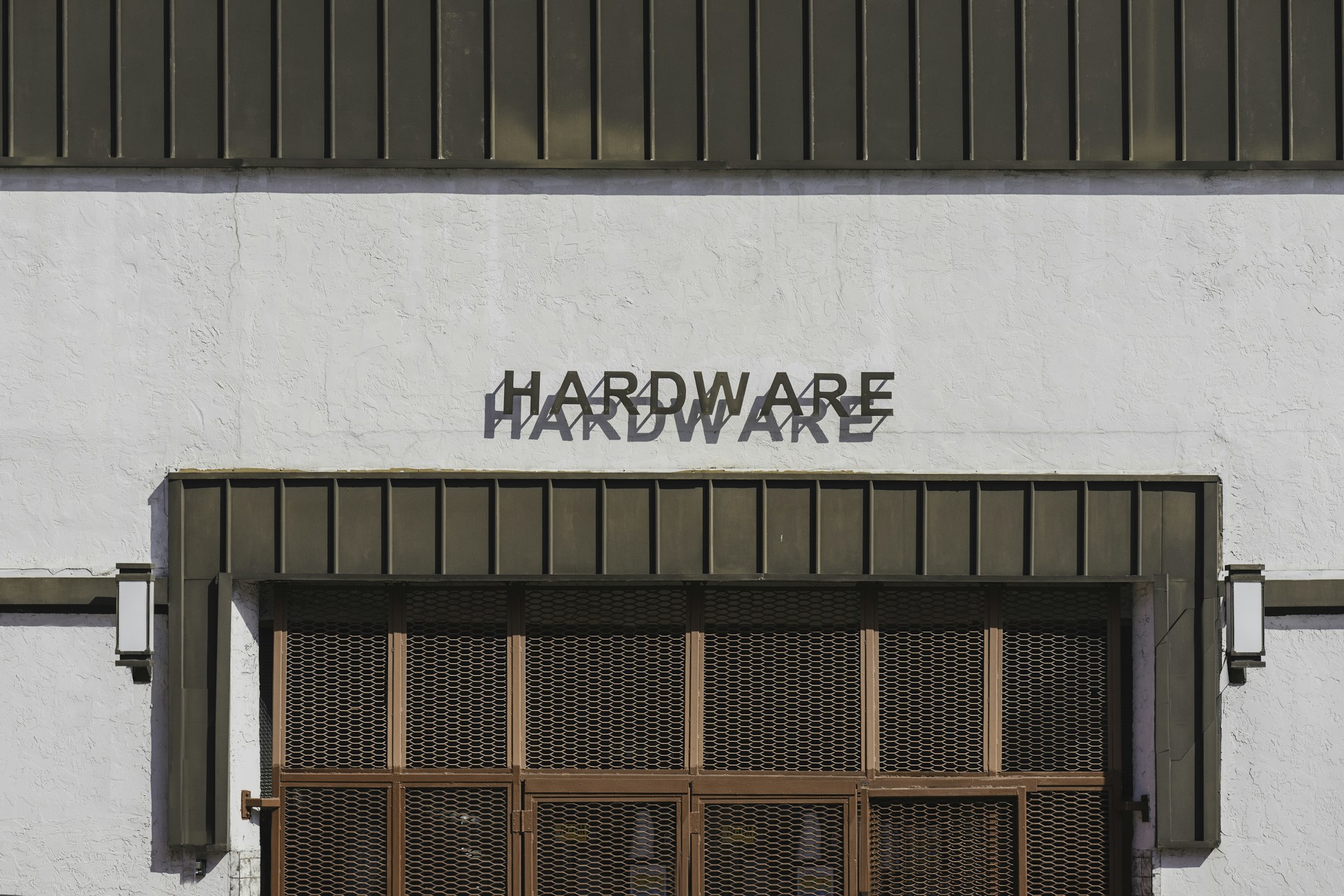 a white building with a sign that says hardware hardware