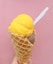yellow ice cream on cone