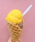 yellow ice cream on cone
