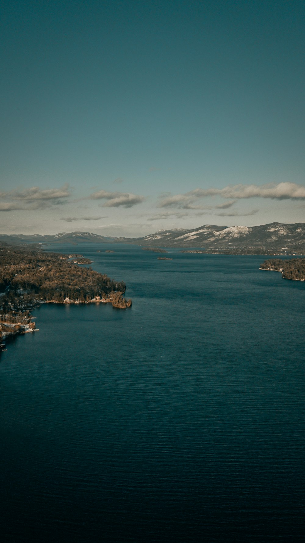 aerial view of city near body of water during daytime