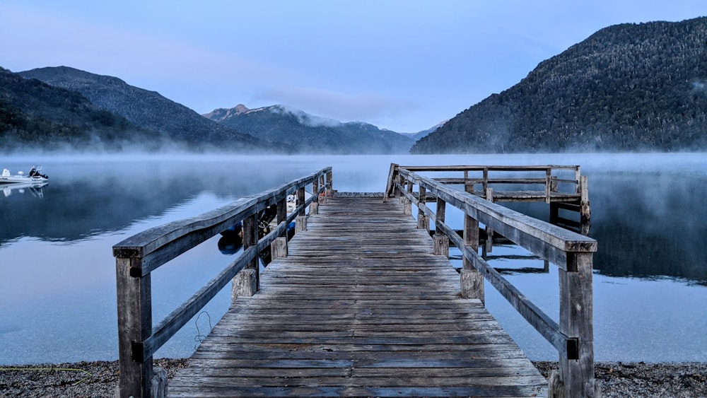 brown wooden dock on lake during daytime