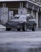 black mercedes benz coupe parked beside brown building during daytime