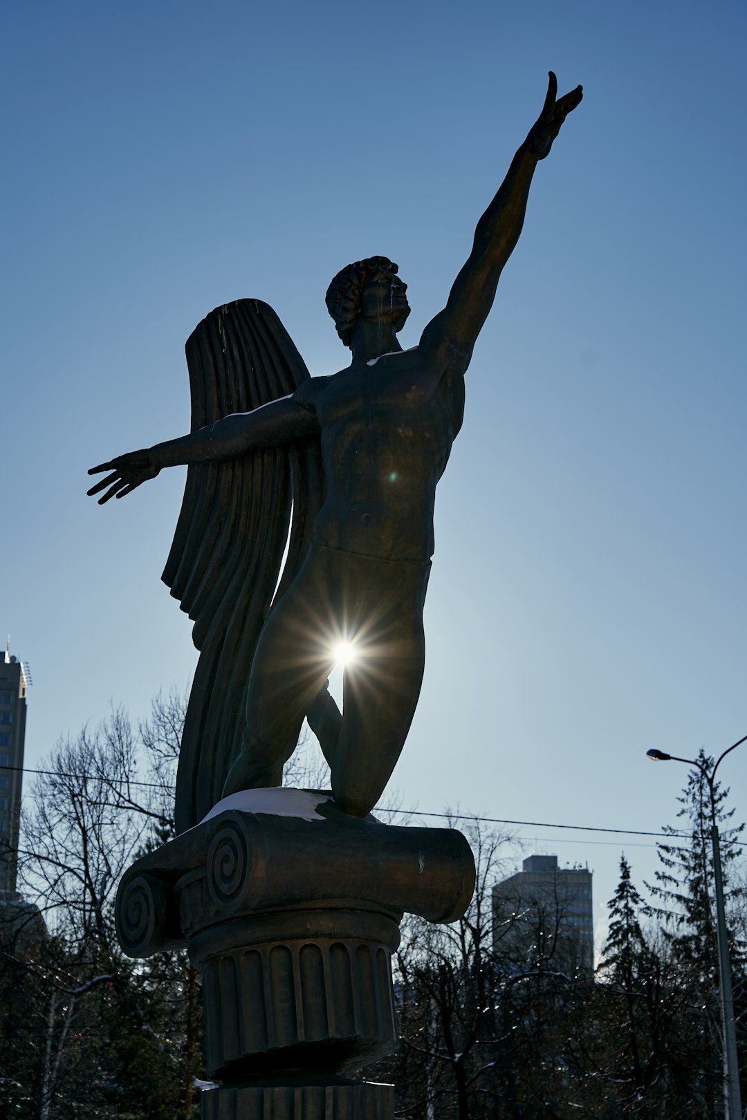 man statue under blue sky during daytime