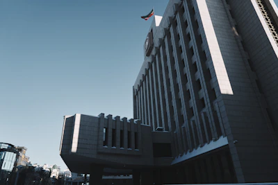 Public sector building with a clear sky, symbolizing institutional transformation.