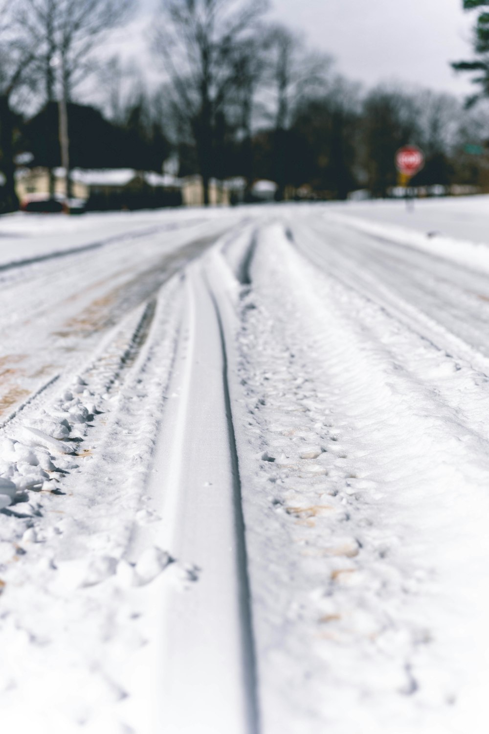 snow covered road during daytime