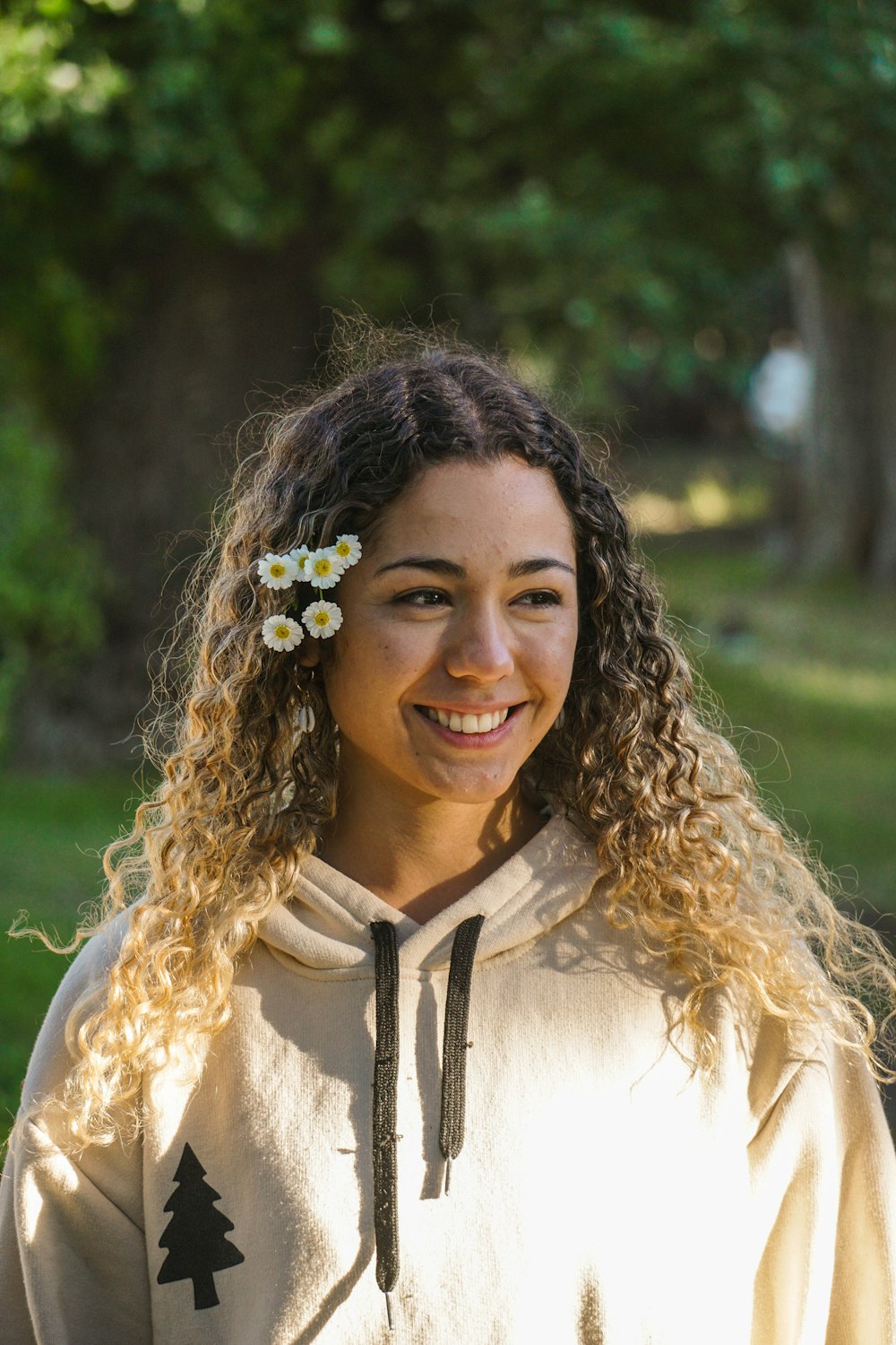 smiling woman in white and black shirt