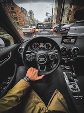 person driving car during daytime