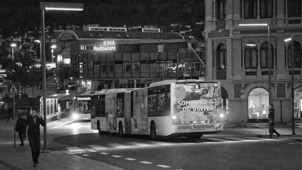grayscale photo of double decker bus on road