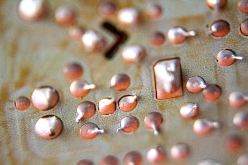 red and silver beads on gray surface