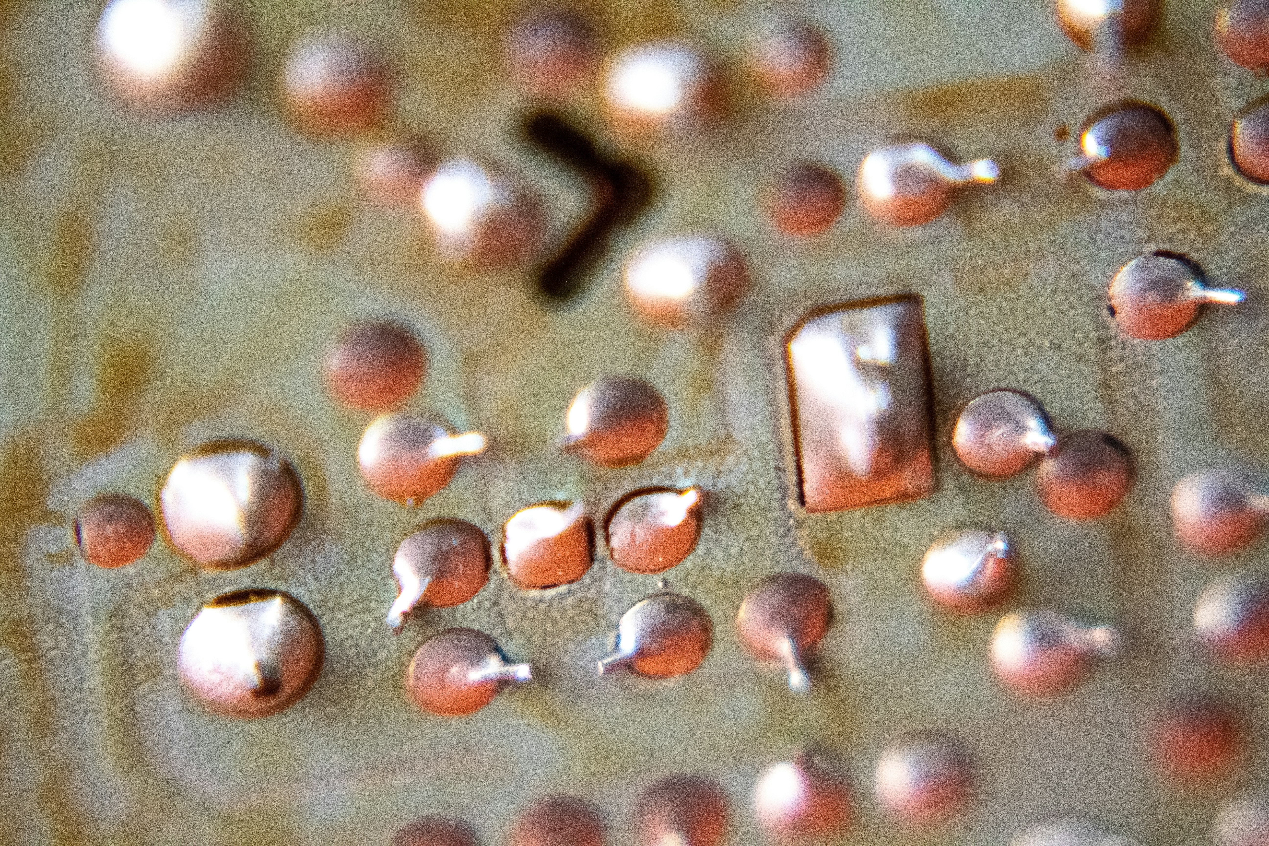 red and silver beads on gray surface