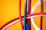 A close-up of various electrical cables in vibrant colors.