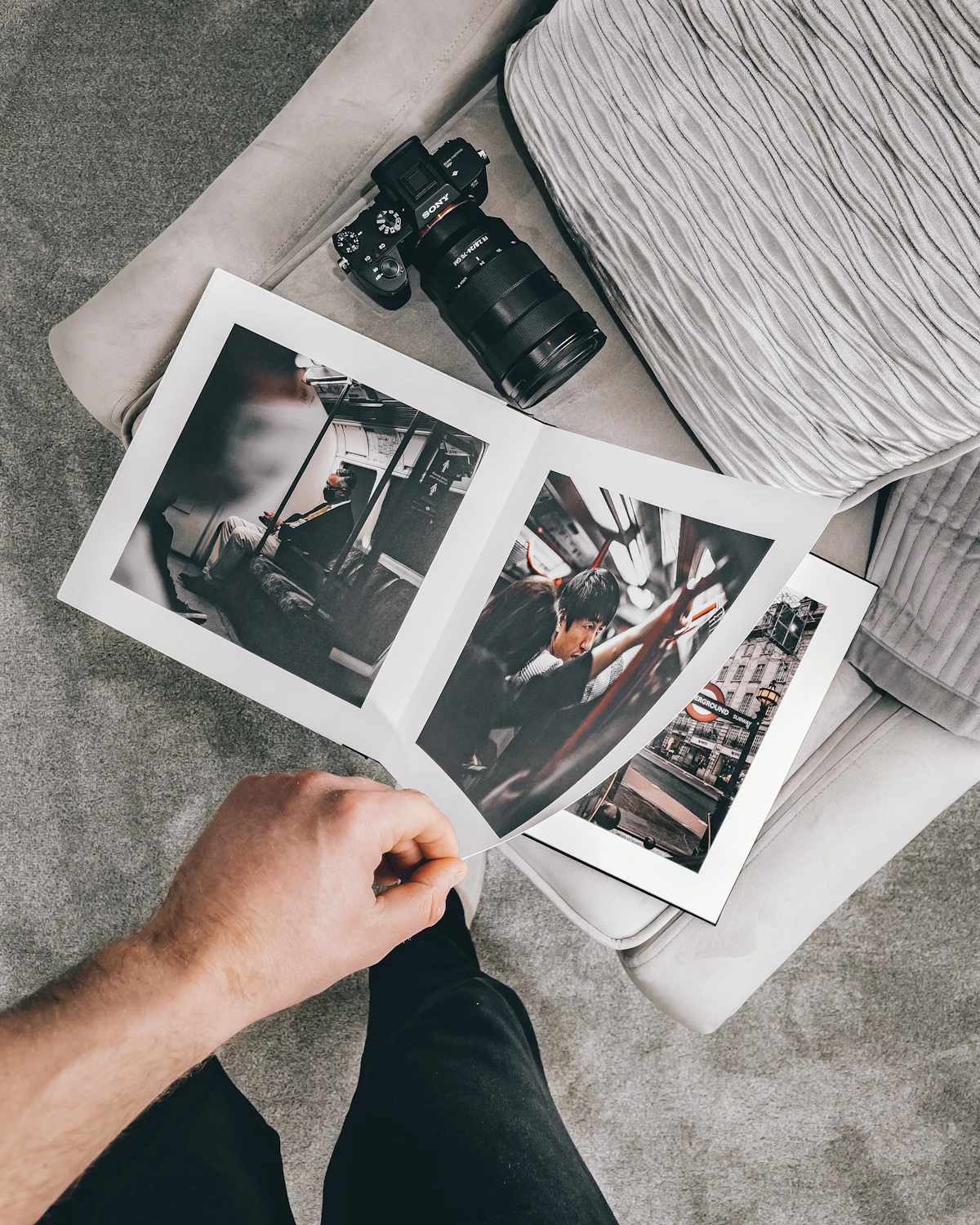 Printed photographs held in a hand