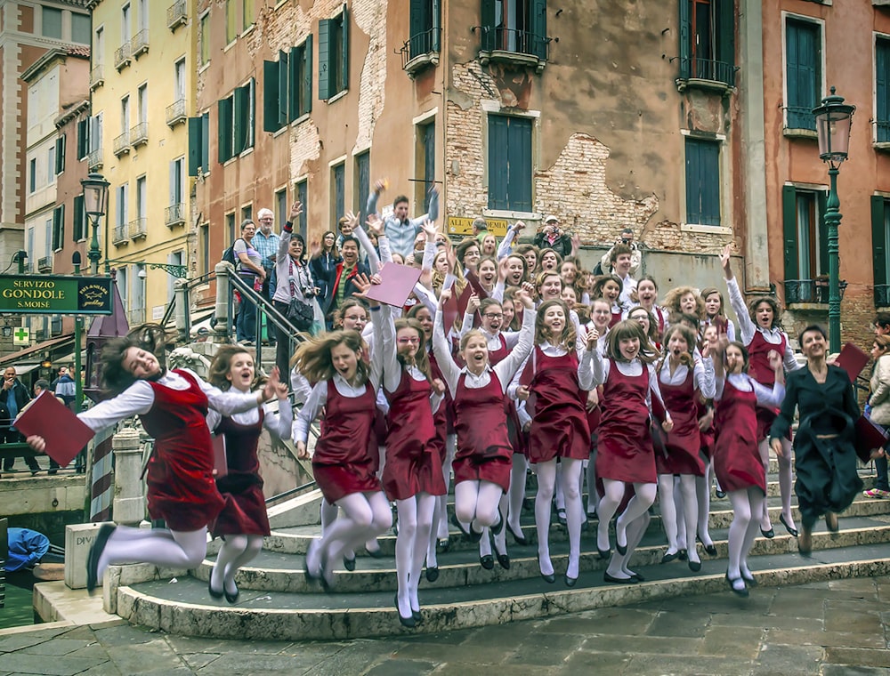 group of people in red and white shirts