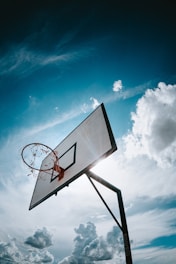 basketball hoop under blue sky during daytime