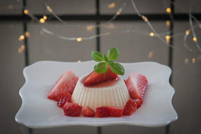 strawberry on white ceramic plate