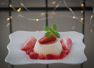 strawberry on white ceramic plate