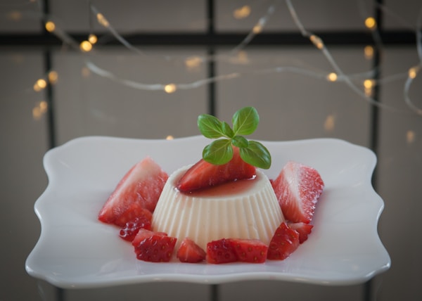 strawberry on white ceramic plate