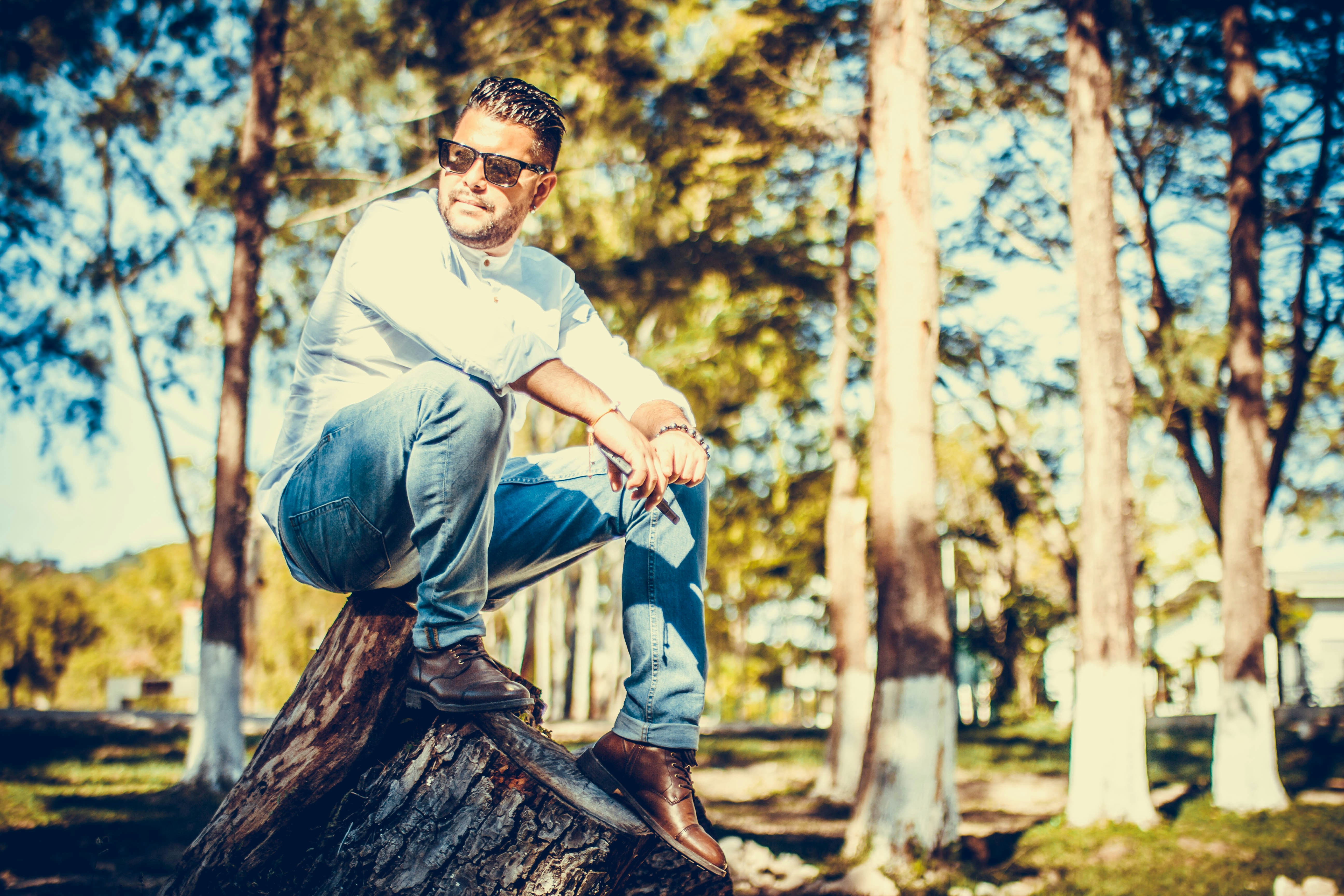 Man In Blue Polo Shirt Standing In The Middle Of Forest During Daytime Photo Free Plant Image On Unsplash