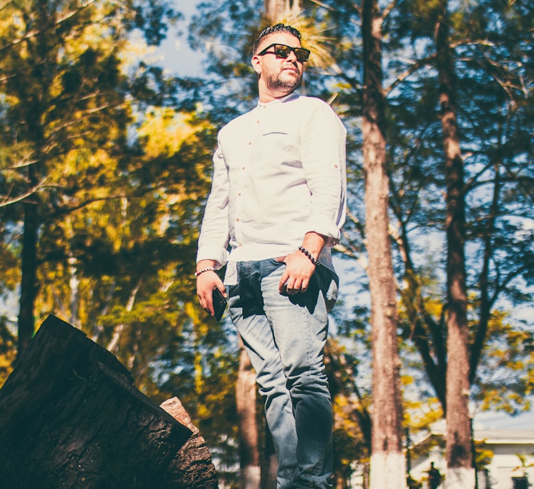 Man standing confidently outdoors in natural light