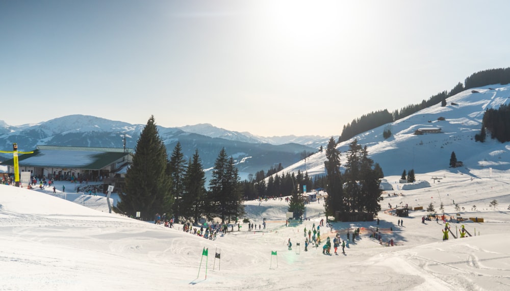 people on snow covered field during daytime