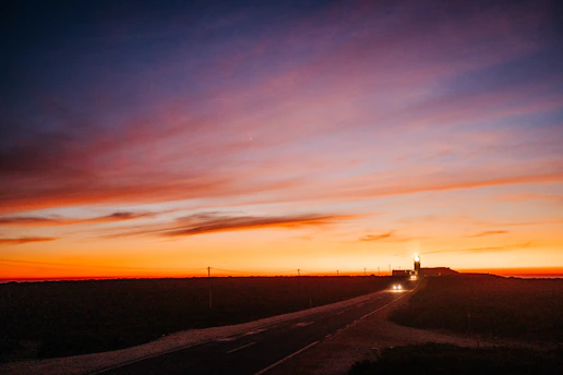 A vibrant sunset over a serene European coastline, inviting wanderlust.