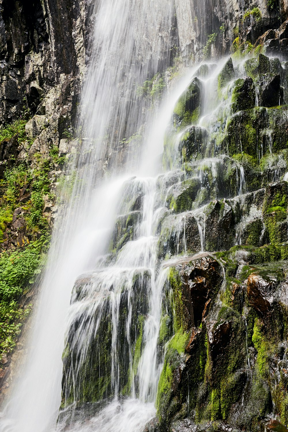 water falls on rocky mountain