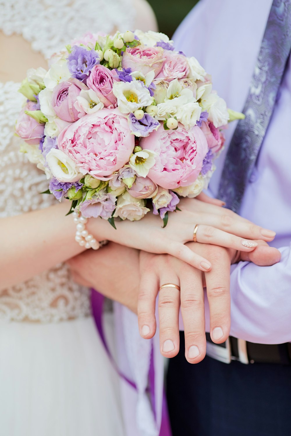 woman holding bouquet of flowers