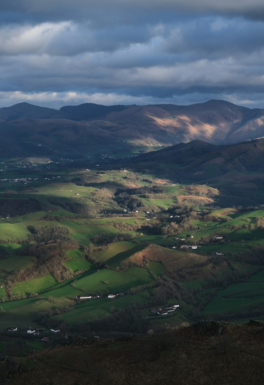 green and brown mountains under white clouds during daytime