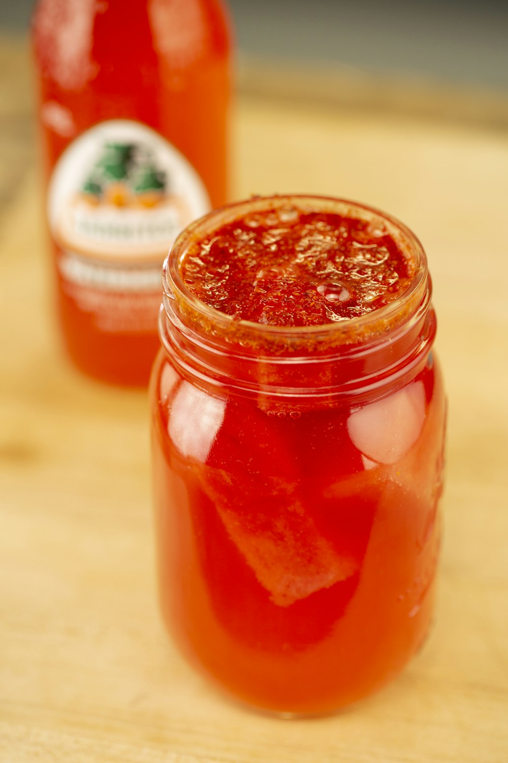 tesco tomato sauce jar on brown wooden table