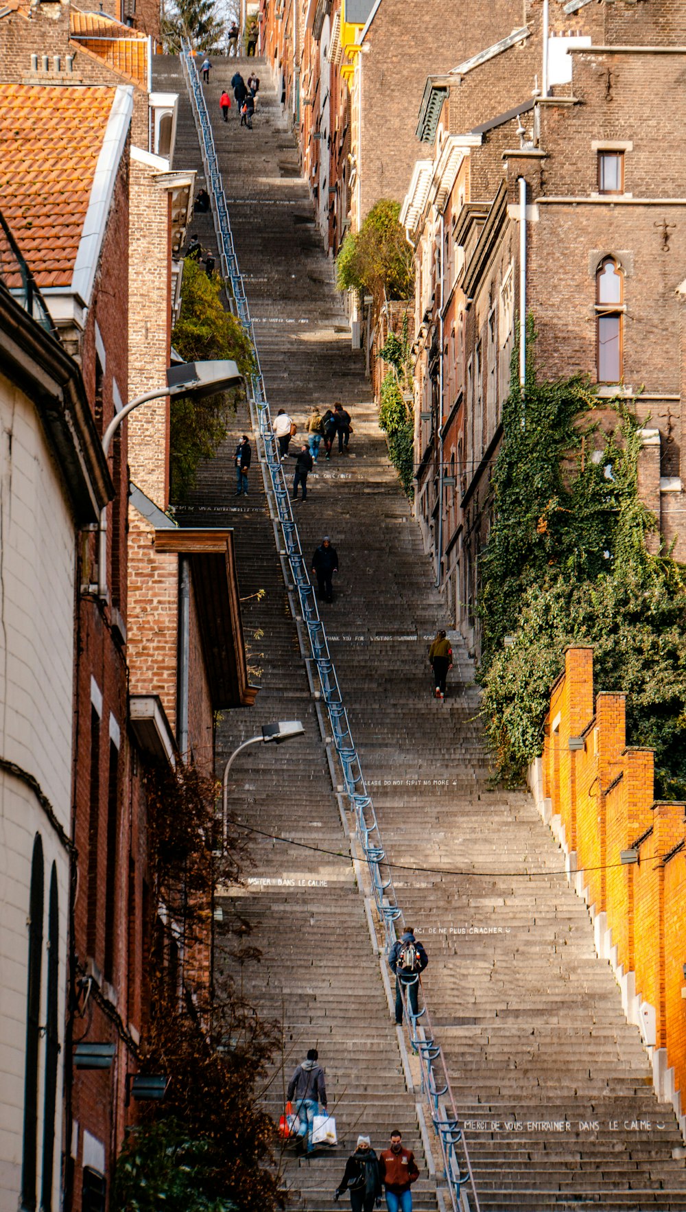 people walking on sidewalk during daytime