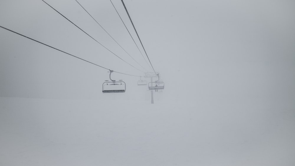 white cable car on foggy weather