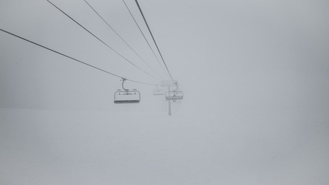 white cable car on foggy weather, Chairlift in Snowstorm